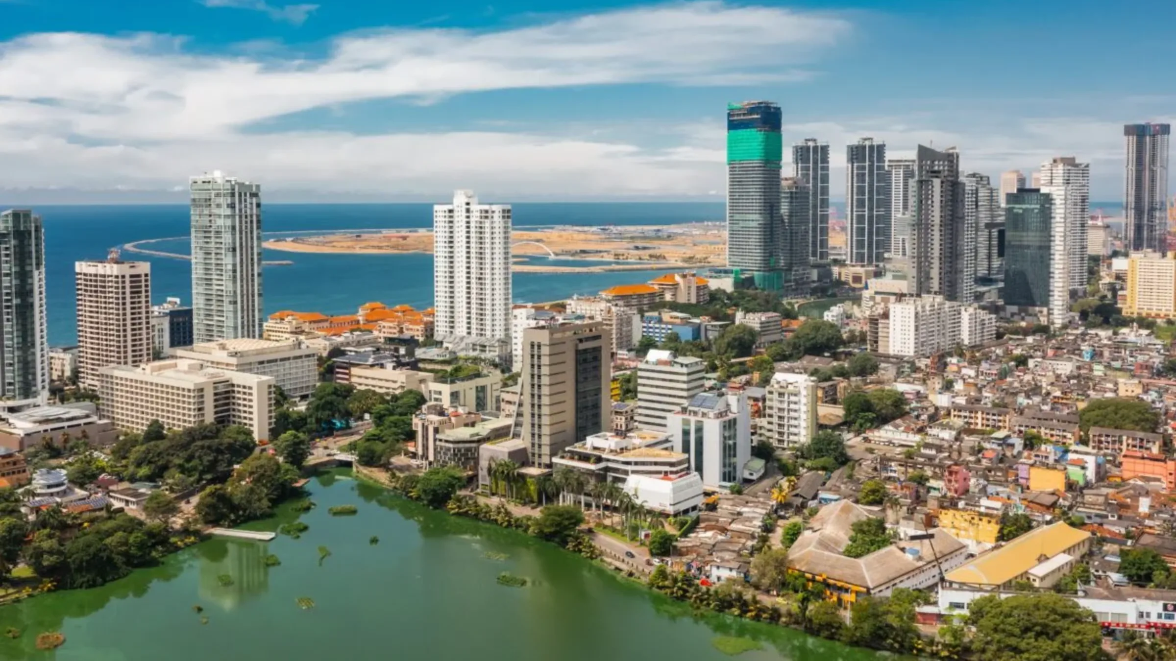 Aerial view of Colombo's coastal skyline with high-rises overlooking the Indian Ocean