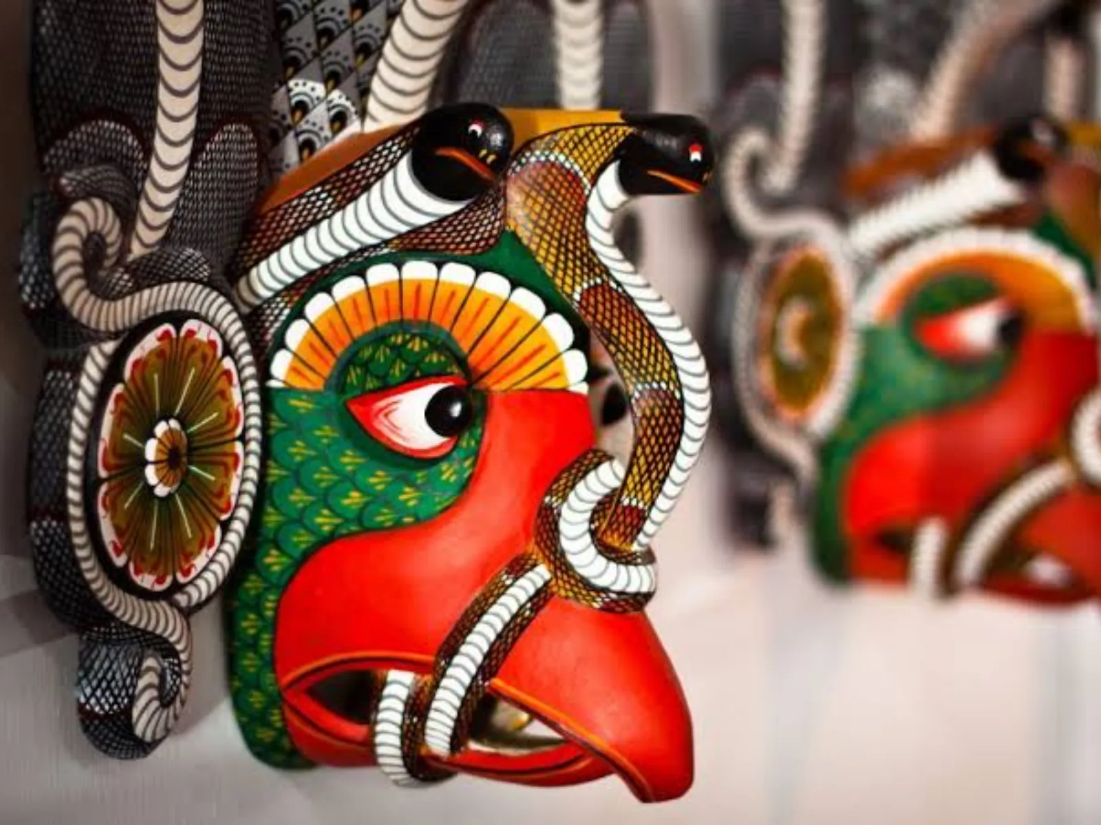 Hand-carved traditional masks displayed in Ambalangoda