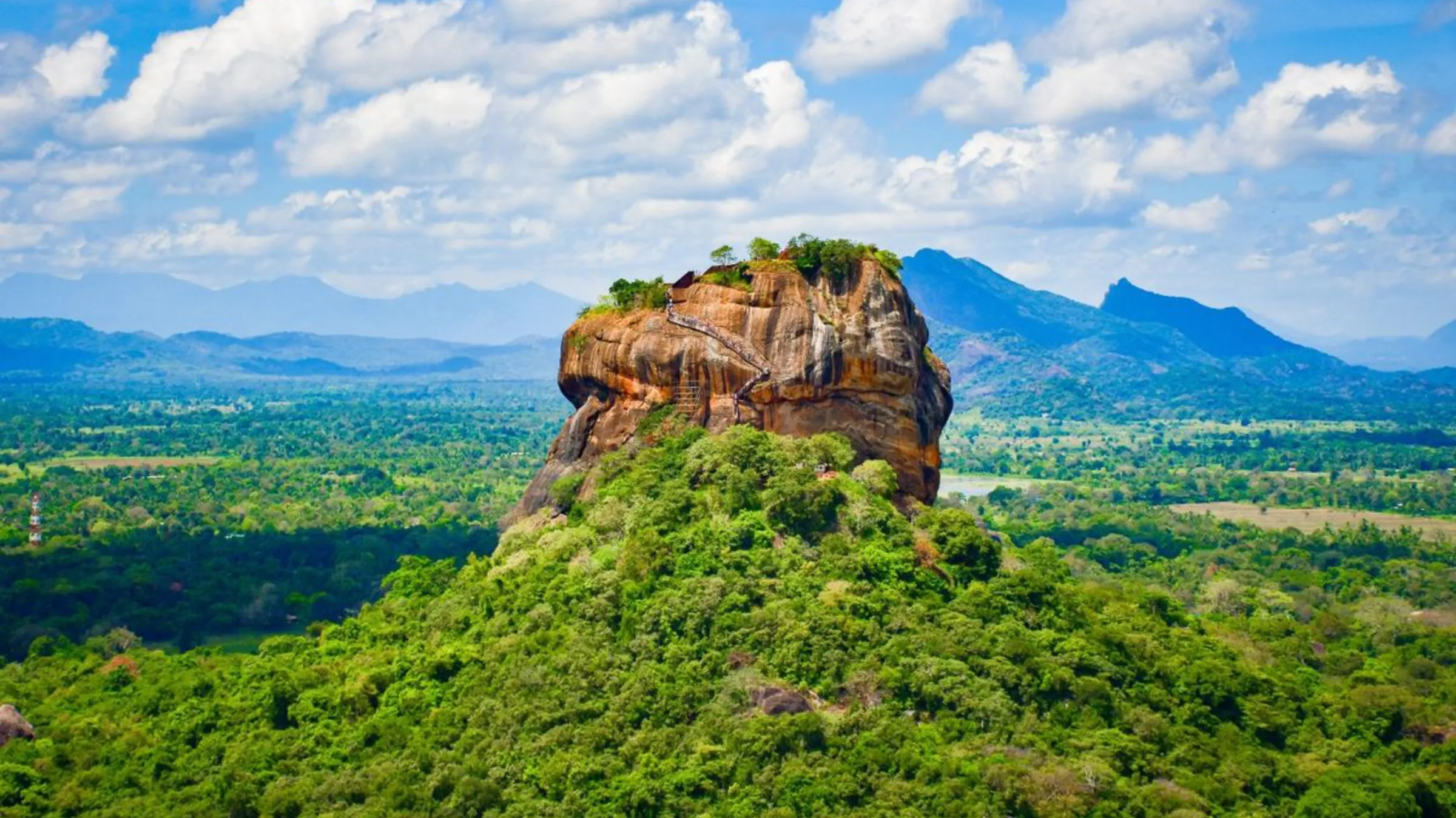 The ancient rock fortress of Sigiriya rising above the surrounding jungle, Sri Lanka