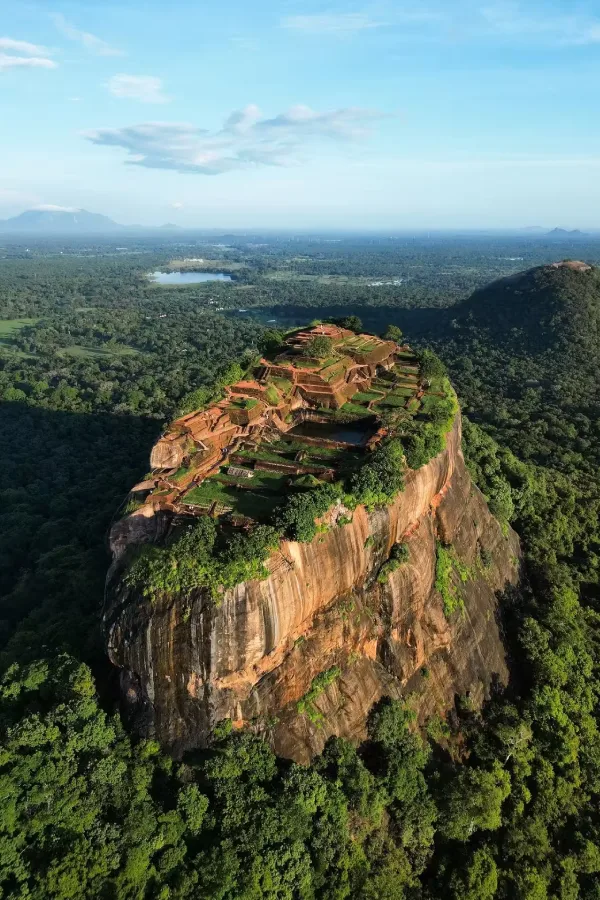 The ancient rock fortress of Sigiriya rising above the jungle